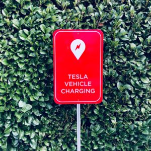 tesla vehicle charging sign