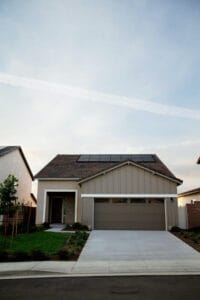 house showing garage with solar panels