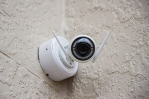 wireless security camera installed on outside wall