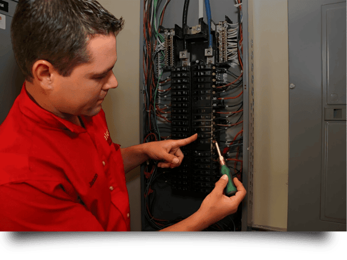 Elcon Electric technician working on electrical panel