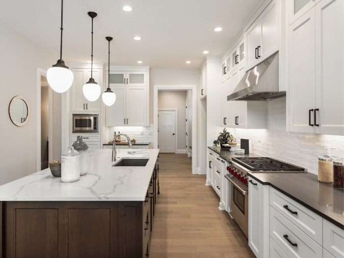 Modern Fort Lauderdale kitchen with recessed lighting and pendant fixtures above the island